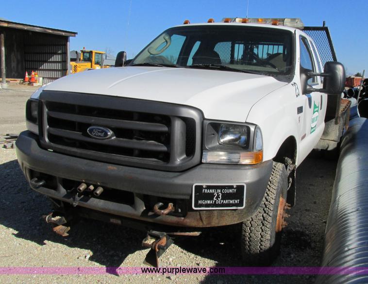 image for item AW9782 2004 Ford F350 Super Duty SuperCab flatbed pickup truck
