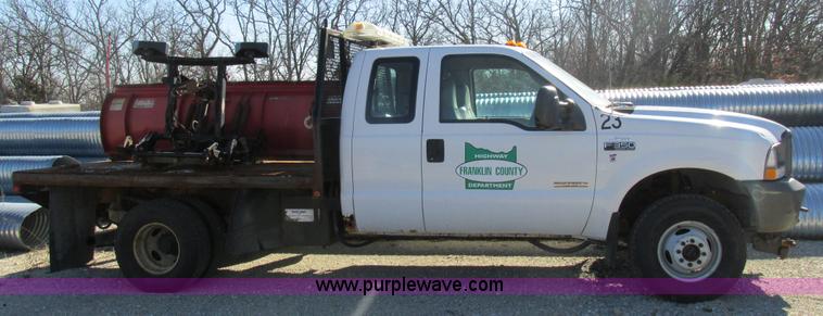 image for item AW9782 2004 Ford F350 Super Duty SuperCab flatbed pickup truck