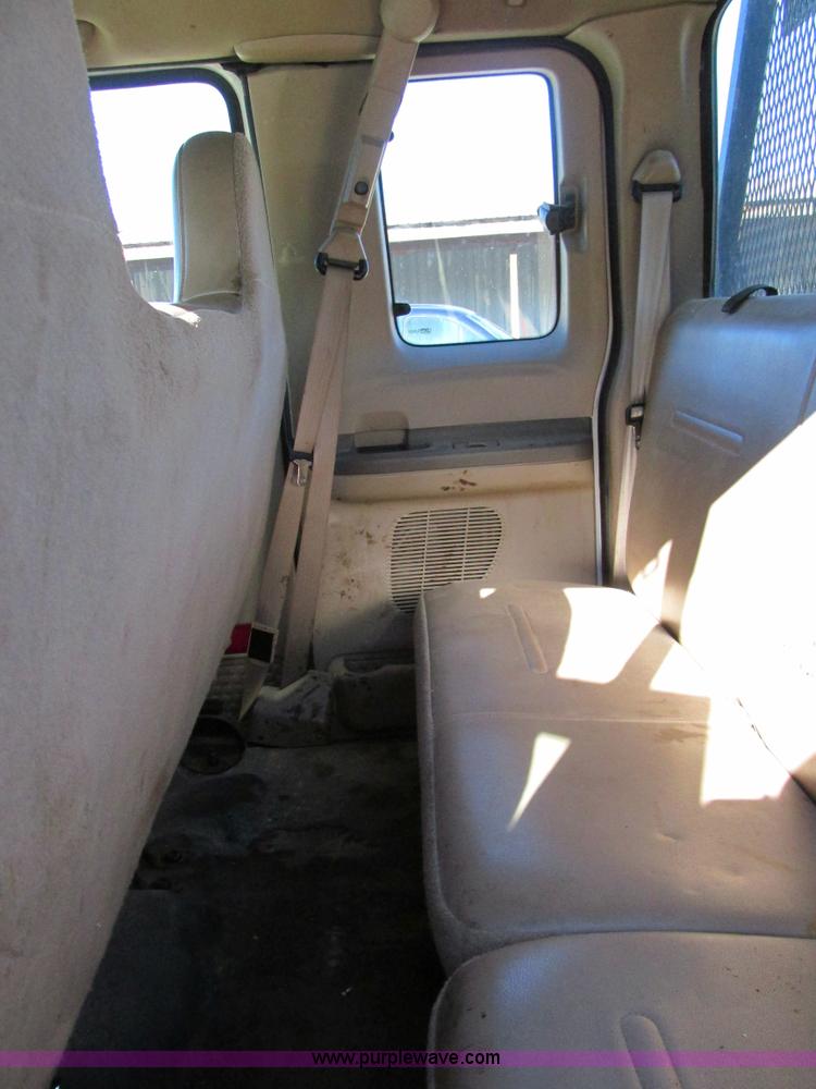 image for item AW9782 2004 Ford F350 Super Duty SuperCab flatbed pickup truck