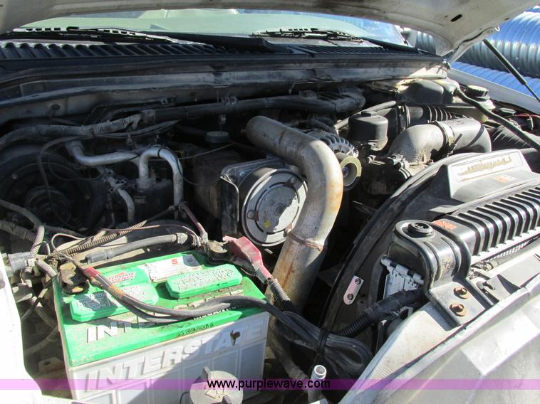 image for item AW9782 2004 Ford F350 Super Duty SuperCab flatbed pickup truck