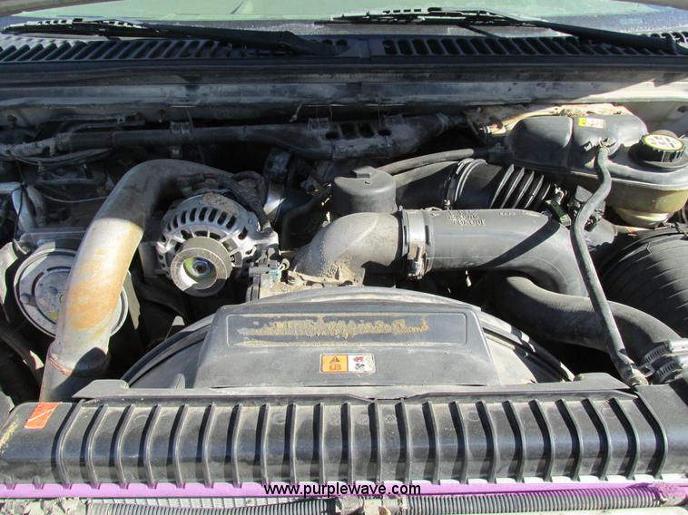 image for item AW9782 2004 Ford F350 Super Duty SuperCab flatbed pickup truck