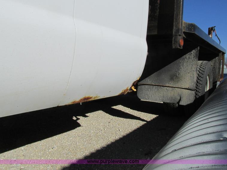 image for item AW9782 2004 Ford F350 Super Duty SuperCab flatbed pickup truck