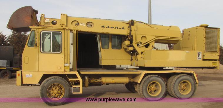 image for item G9796 Gradall G660E rubber tired excavator