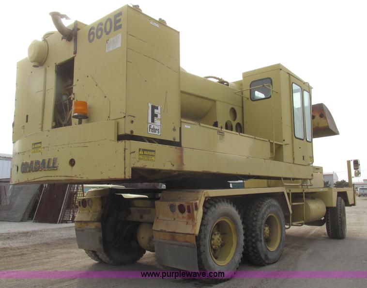 image for item G9796 Gradall G660E rubber tired excavator