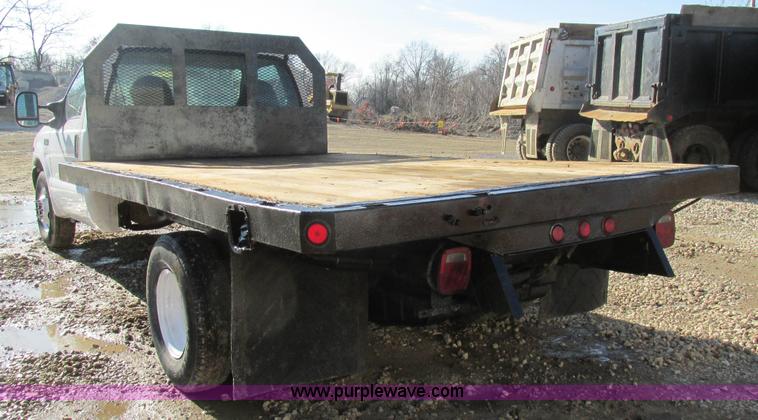 image for item H7613 1999 Ford F350 Super Duty XL flatbed pickup truck