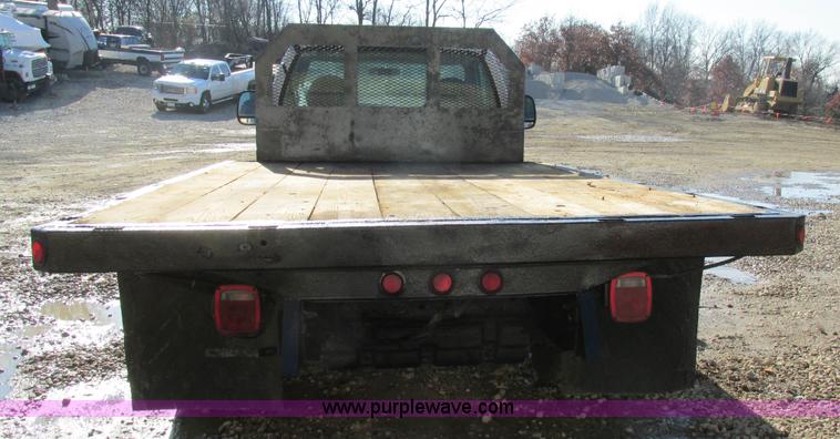 image for item H7613 1999 Ford F350 Super Duty XL flatbed pickup truck