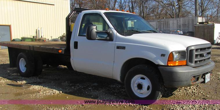 image for item H7613 1999 Ford F350 Super Duty XL flatbed pickup truck