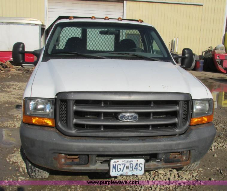 image for item H7613 1999 Ford F350 Super Duty XL flatbed pickup truck