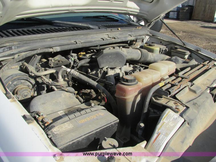 image for item H7613 1999 Ford F350 Super Duty XL flatbed pickup truck