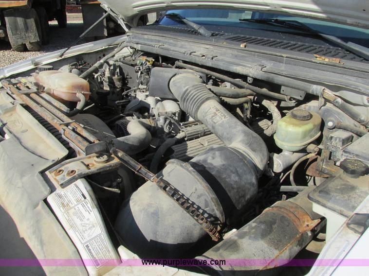 image for item H7613 1999 Ford F350 Super Duty XL flatbed pickup truck