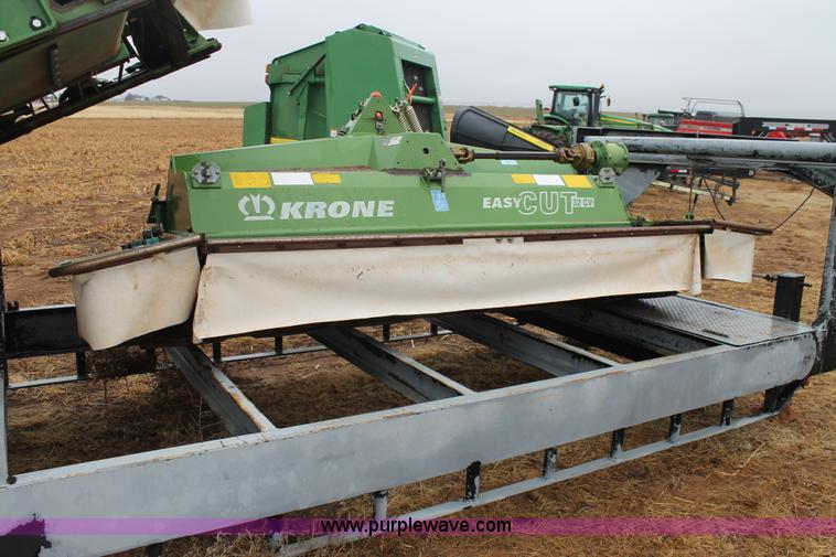 image for item H1630 (2) 2005 Krone disc mower windrowers with shop built trailer