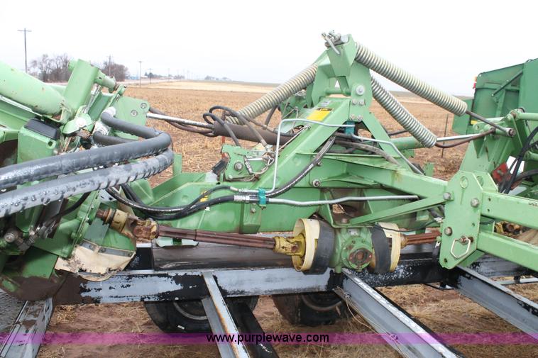 image for item H1630 (2) 2005 Krone disc mower windrowers with shop built trailer