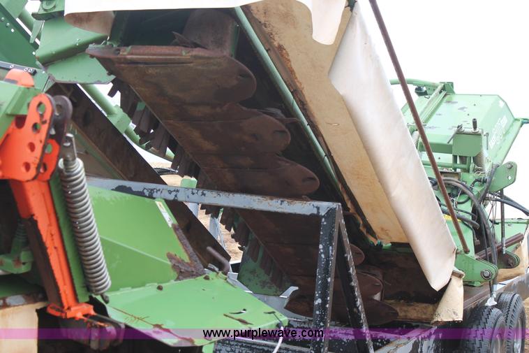 image for item H1630 (2) 2005 Krone disc mower windrowers with shop built trailer