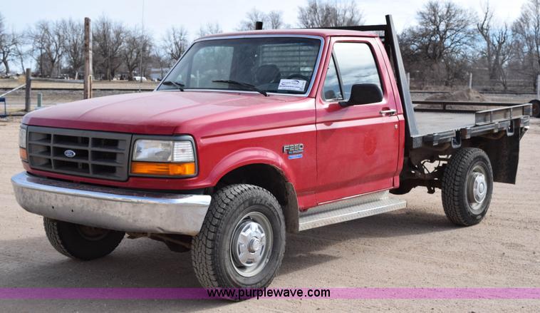image for item K2302 1994 Ford F250 XL HD flatbed pickup truck