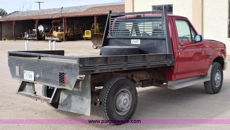 image for item K2302 1994 Ford F250 XL HD flatbed pickup truck
