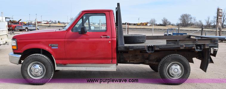 image for item K2302 1994 Ford F250 XL HD flatbed pickup truck