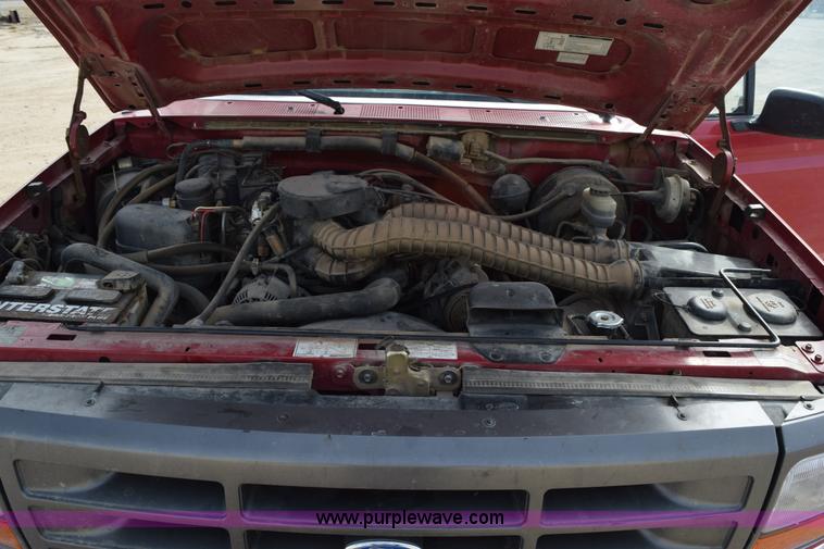 image for item K2302 1994 Ford F250 XL HD flatbed pickup truck