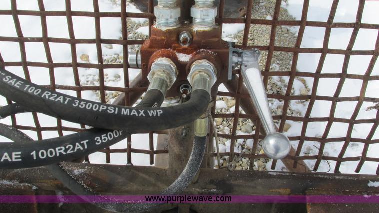 image for item AC9763 Hydraulic tree saw skid steer attachment