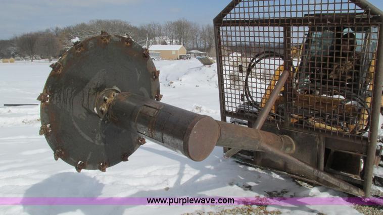 image for item AC9763 Hydraulic tree saw skid steer attachment