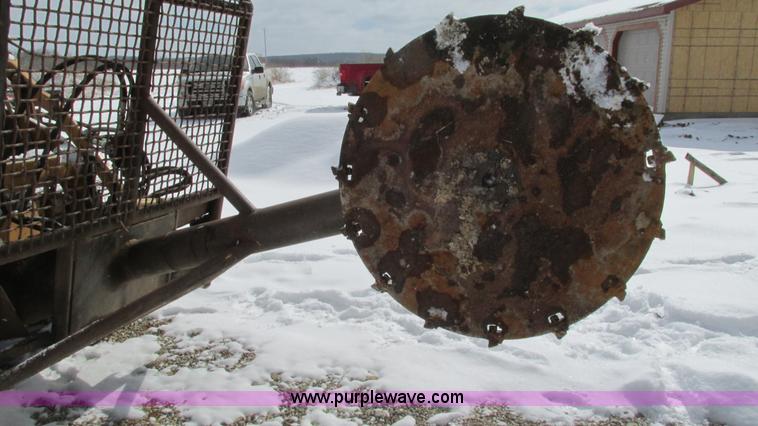 image for item AC9763 Hydraulic tree saw skid steer attachment