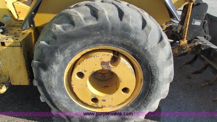 image for item K2003 1999 John Deere 210LE landscape tractor