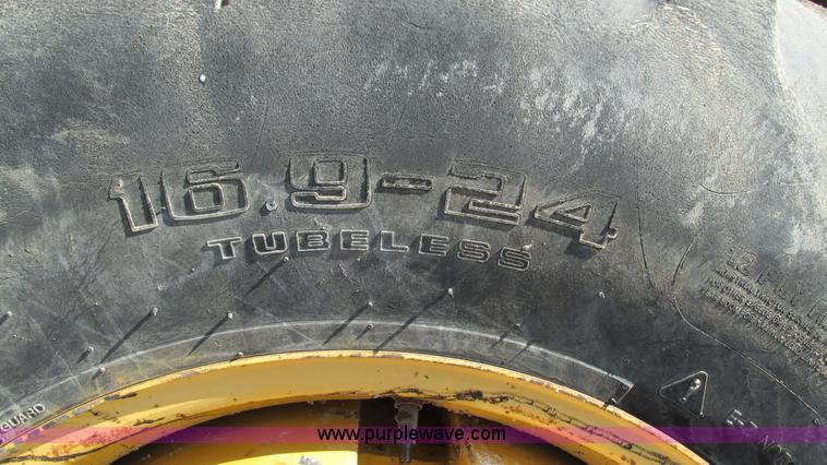 image for item K2003 1999 John Deere 210LE landscape tractor