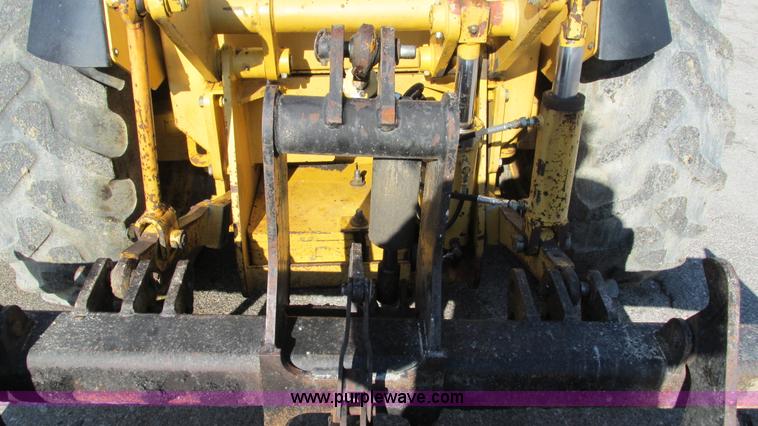 image for item K2003 1999 John Deere 210LE landscape tractor