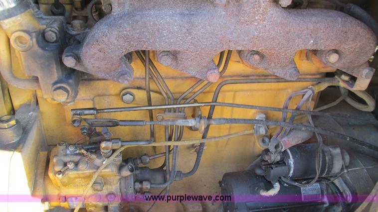 image for item K2003 1999 John Deere 210LE landscape tractor