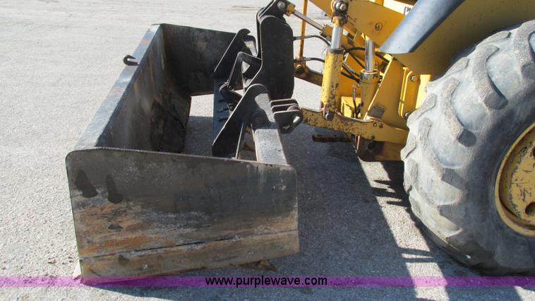 image for item K2003 1999 John Deere 210LE landscape tractor