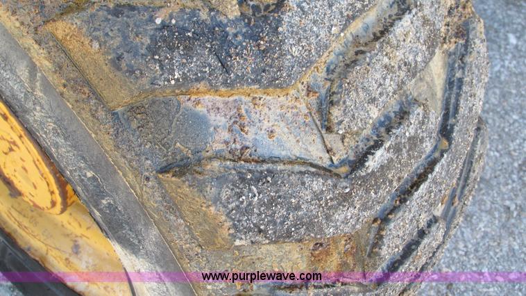 image for item K2003 1999 John Deere 210LE landscape tractor