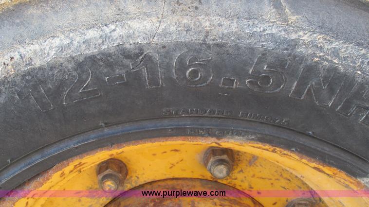 image for item K2003 1999 John Deere 210LE landscape tractor