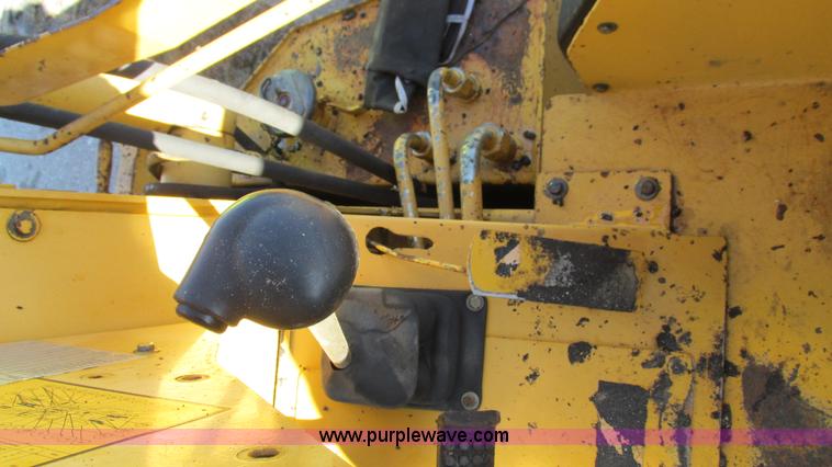 image for item K2003 1999 John Deere 210LE landscape tractor