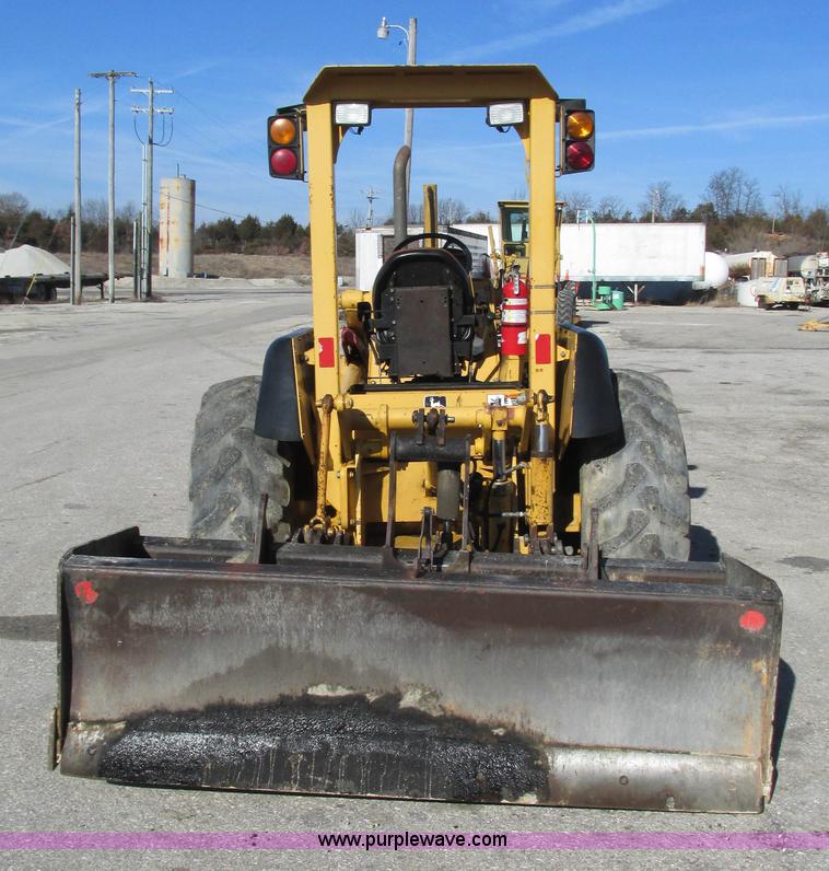 image for item K2003 1999 John Deere 210LE landscape tractor