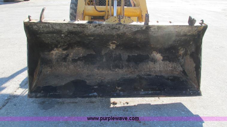 image for item K2003 1999 John Deere 210LE landscape tractor