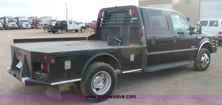 image for item AW9470 2006 Ford F350 Super Duty Crew Cab flatbed truck