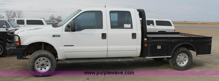 image for item H1595 2001 Ford F350 Super Duty Crew Cab flatbed truck