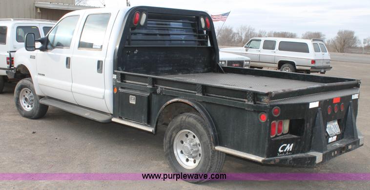 image for item H1595 2001 Ford F350 Super Duty Crew Cab flatbed truck