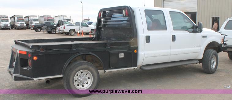 image for item H1595 2001 Ford F350 Super Duty Crew Cab flatbed truck