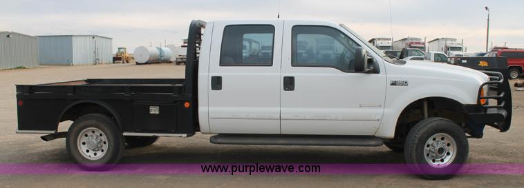 image for item H1595 2001 Ford F350 Super Duty Crew Cab flatbed truck
