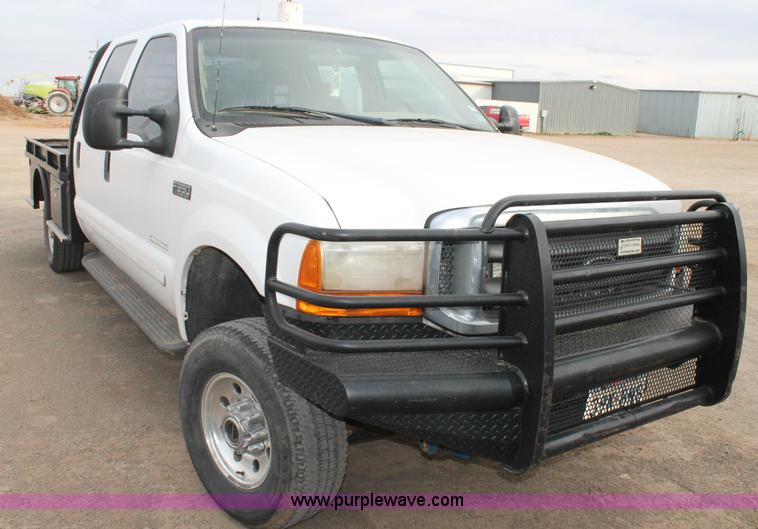 image for item H1595 2001 Ford F350 Super Duty Crew Cab flatbed truck