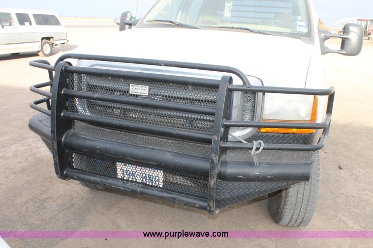 image for item H1595 2001 Ford F350 Super Duty Crew Cab flatbed truck