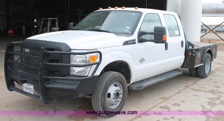 image for item H1602 2014 Ford F350 Super Duty Crew Cab flatbed truck