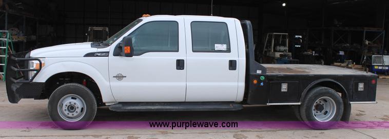 image for item H1602 2014 Ford F350 Super Duty Crew Cab flatbed truck