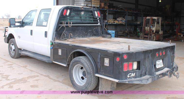 image for item H1602 2014 Ford F350 Super Duty Crew Cab flatbed truck