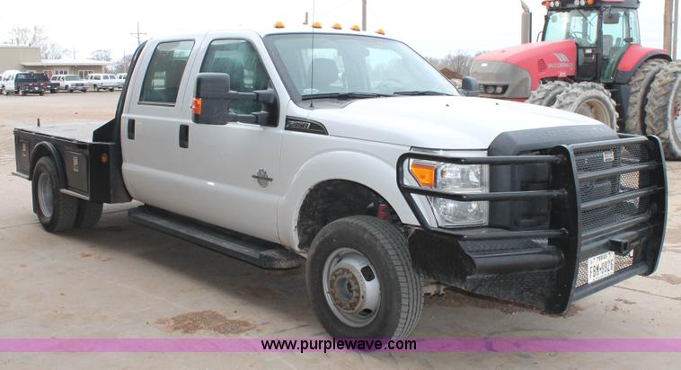 image for item H1602 2014 Ford F350 Super Duty Crew Cab flatbed truck
