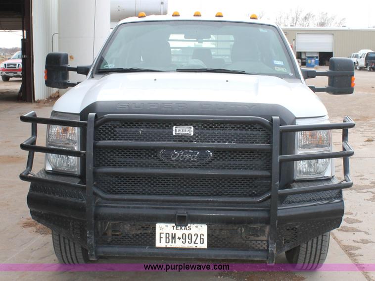 image for item H1602 2014 Ford F350 Super Duty Crew Cab flatbed truck