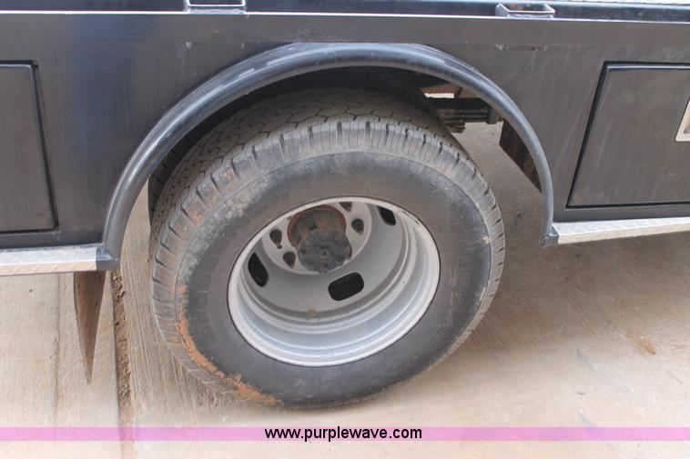 image for item H1602 2014 Ford F350 Super Duty Crew Cab flatbed truck