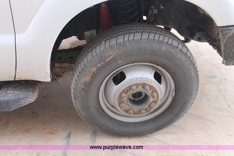 image for item H1602 2014 Ford F350 Super Duty Crew Cab flatbed truck