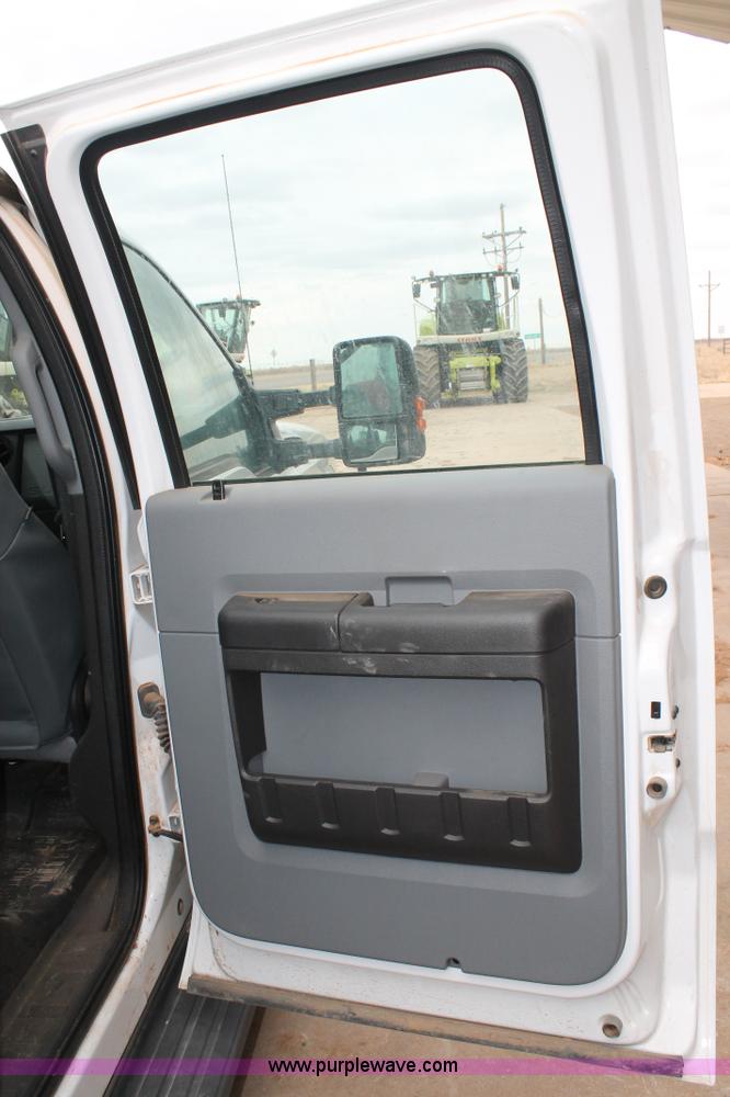 image for item H1602 2014 Ford F350 Super Duty Crew Cab flatbed truck