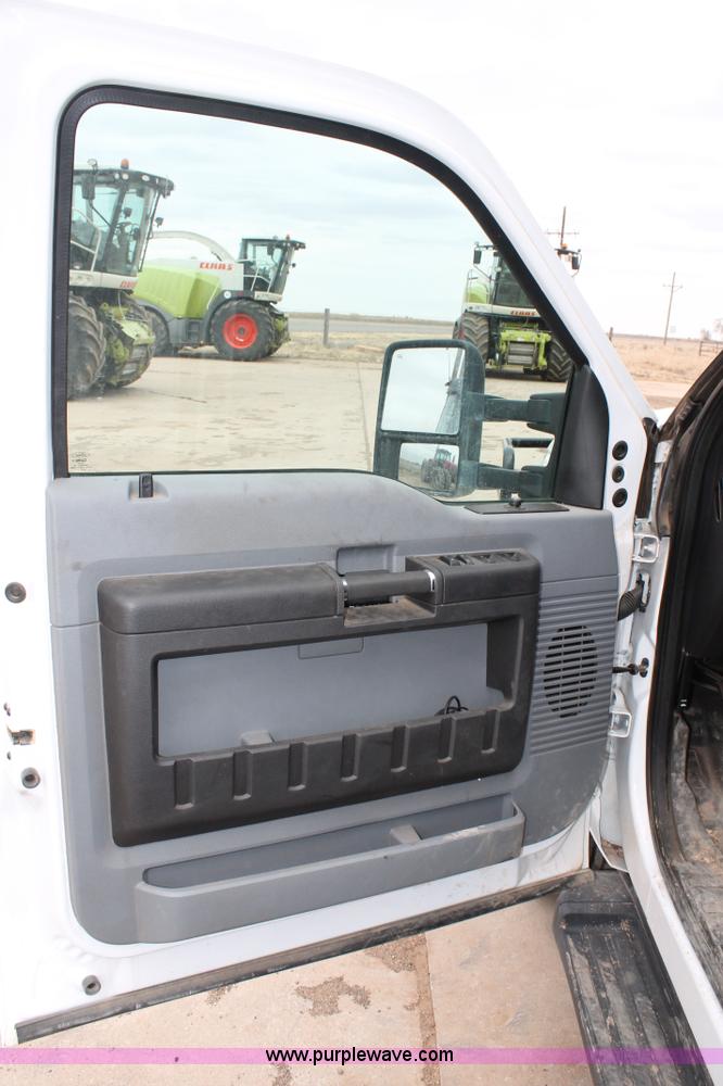 image for item H1602 2014 Ford F350 Super Duty Crew Cab flatbed truck